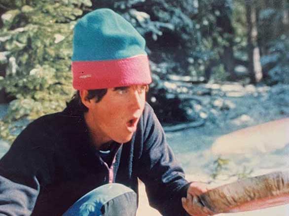 Earl Richmond gets the fire going on an outdoor BOEC program