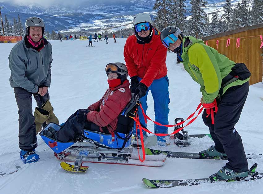 Bonnie poses with her two sons, Andrew (left) and Jason (right) and BOEC Guide JR O'Neil.