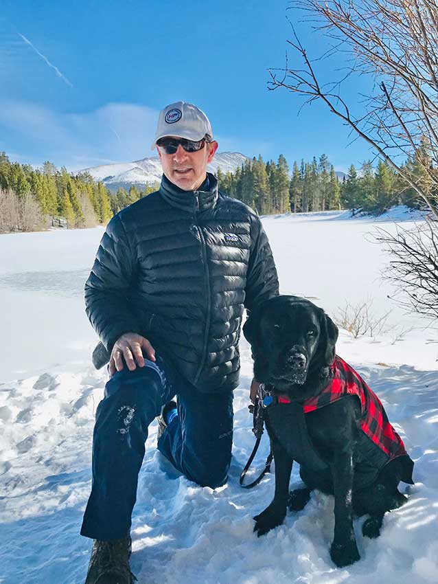 Kevin and his guide dog Weaver in Breckenridge