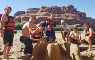 A boys SOAP group poses along the banks of the Green River