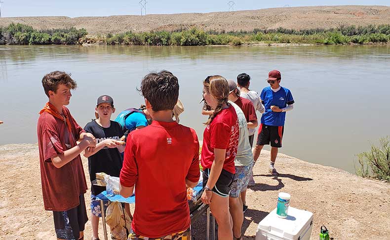 Boys SOAP participants gather for lunch along the Green River.