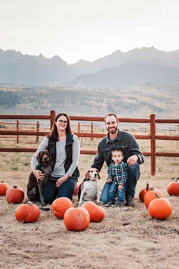 Ben, Lincoln and Holly pose at a pumpkin patch