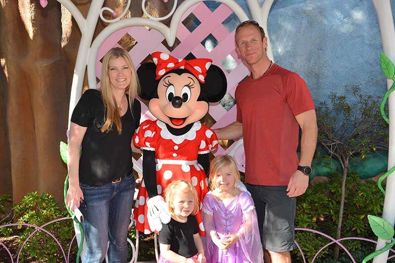 The Beckerman family visits with Minnie Mouse