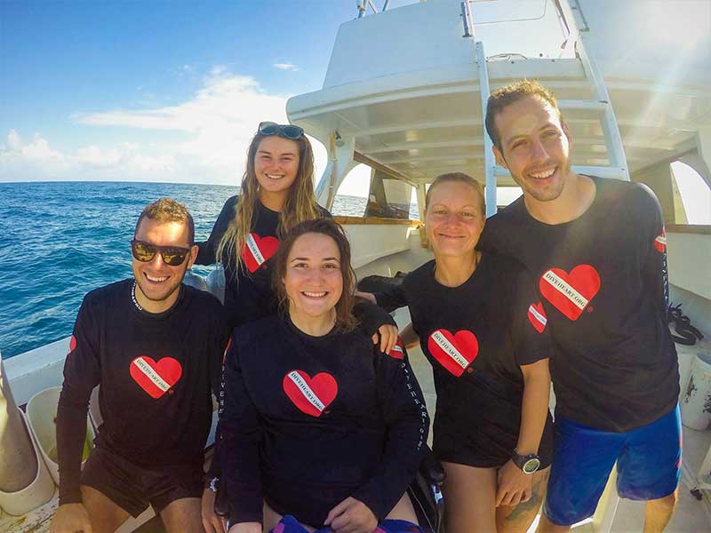 Amber poses on an adaptive scuba diving trip