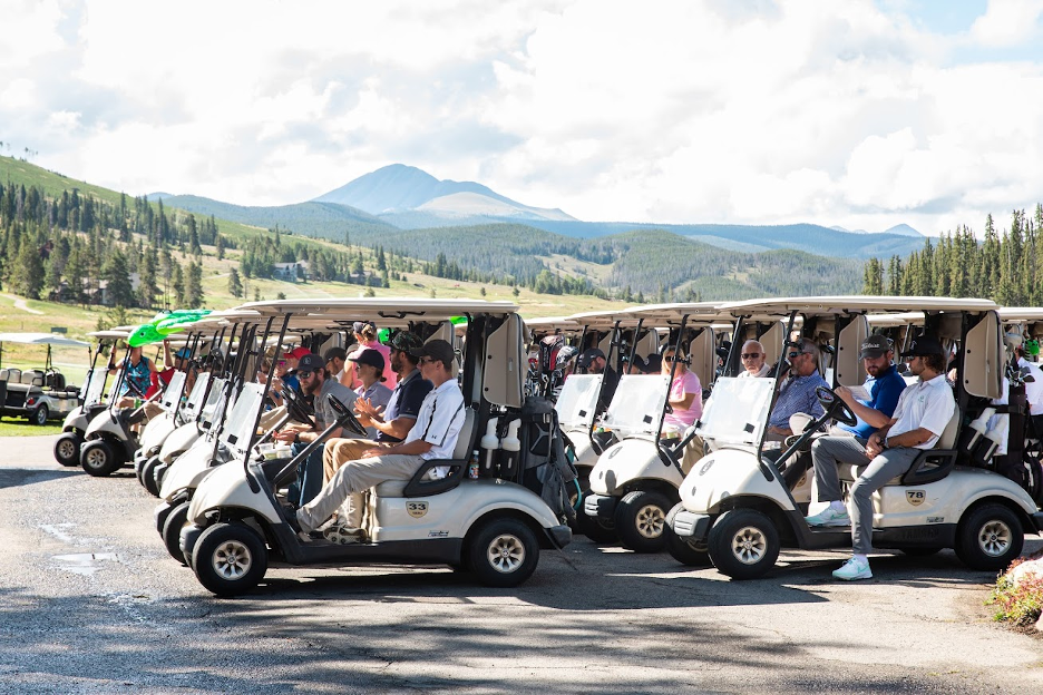 Everybody is ready to get started in their golf carts