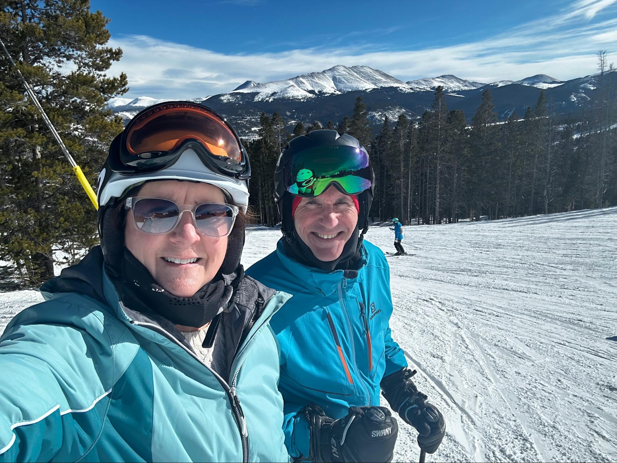 Donna and Brian enjoying a blue sky day on the slopes of Breckenridge