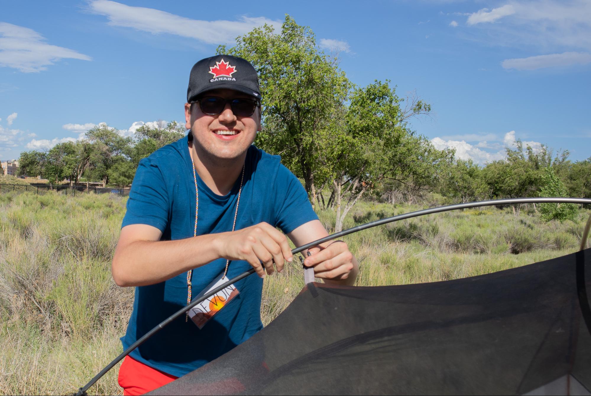 Devon setting up his tent during Wilderness Camp.