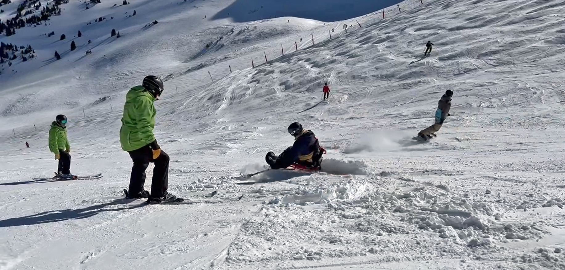 Nick volunteering on a mono-ski lesson with instructor Frank Martinez and mono-skier Jeffrey Buckwalter.