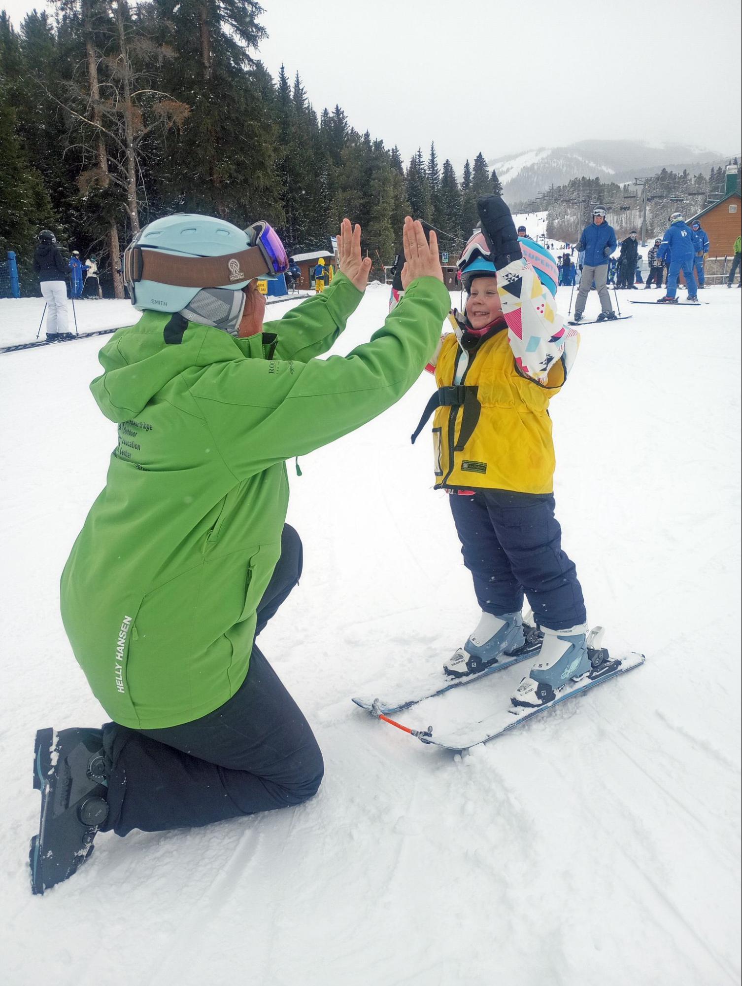 Little Finley gets a high five on her lesson.